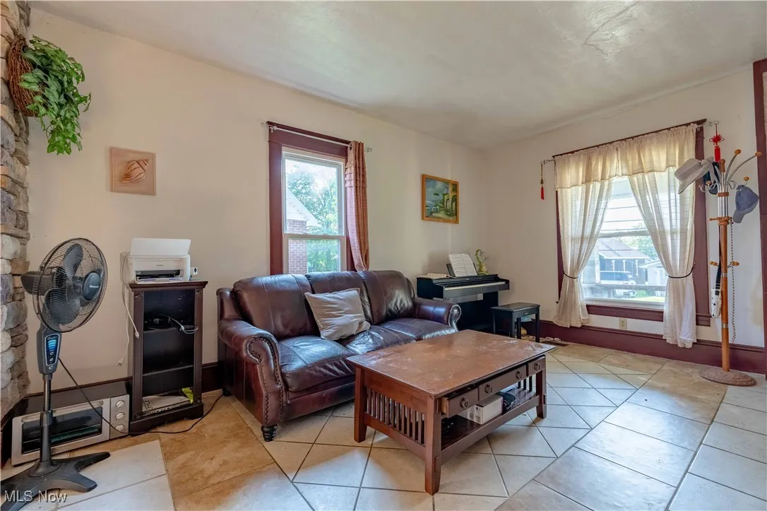 Living area with light tile patterned flooring