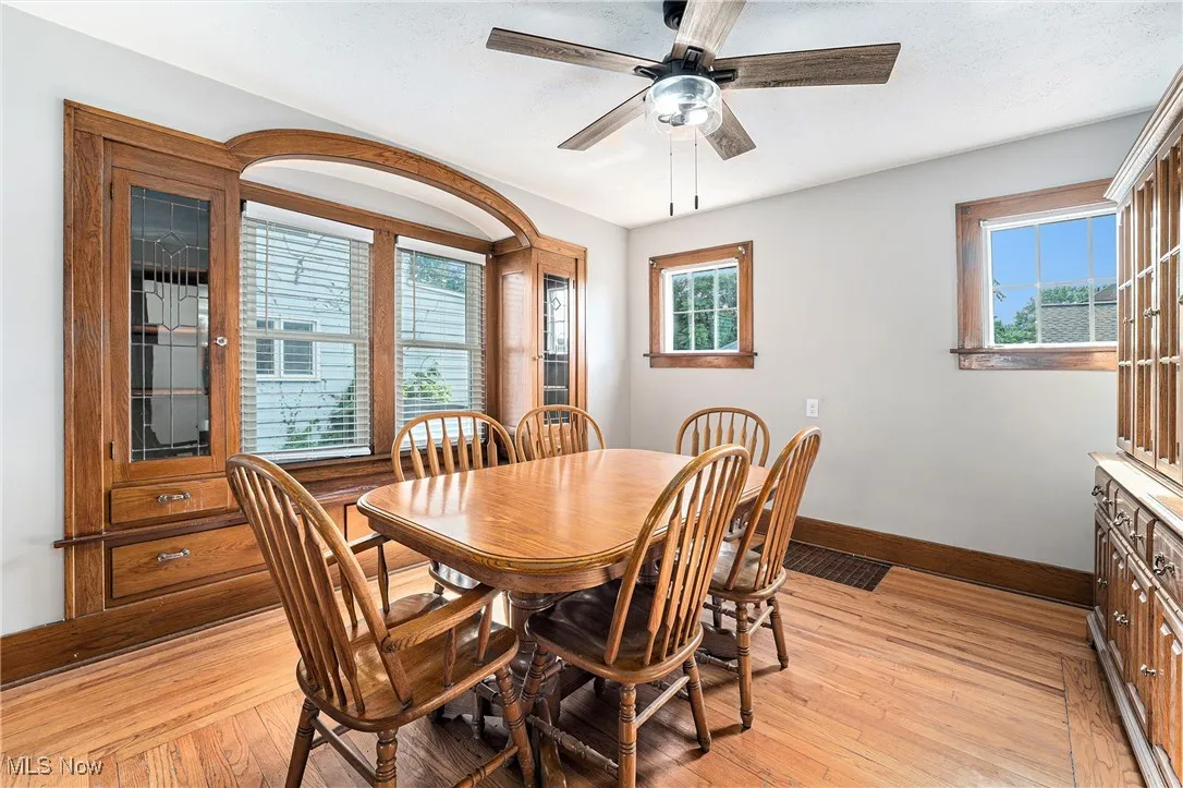 Dining area featuring ceiling fan and light wood-style floors