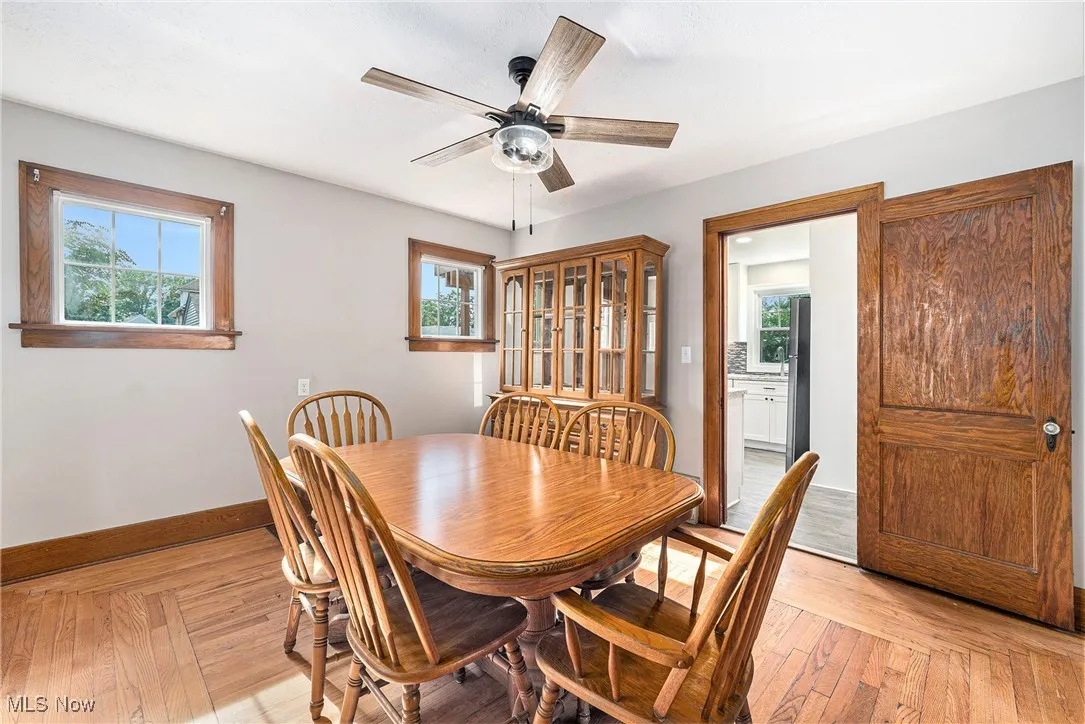 Dining room with baseboards and ceiling fan