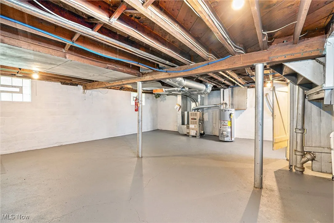 Below grade area with gas water heater and heating unit