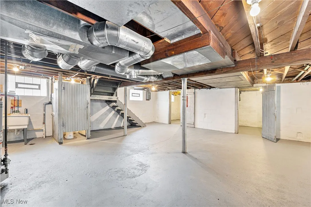 Basement with stairs and plenty of natural light
