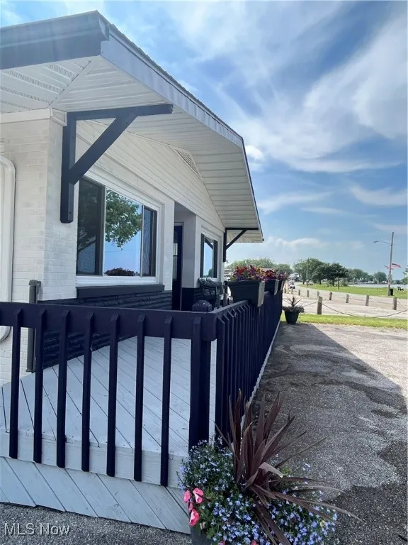 View of side of home featuring brick siding