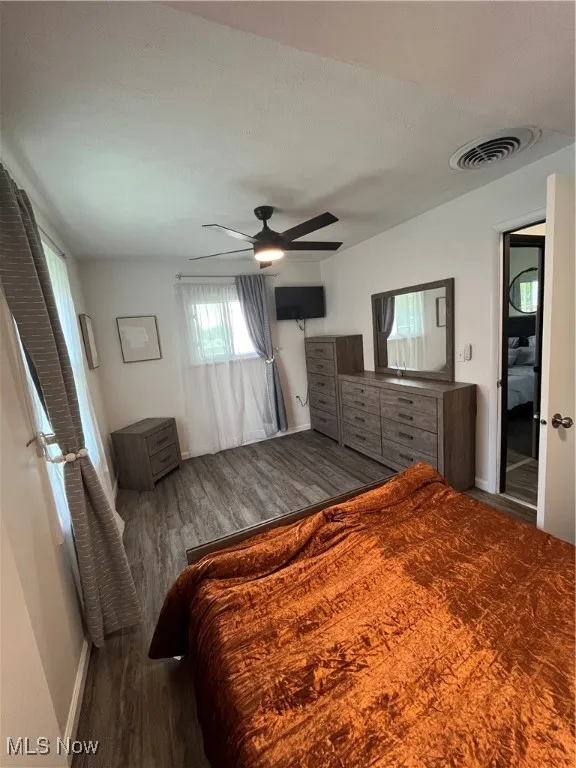 Bedroom featuring wood finished floors and ceiling fan