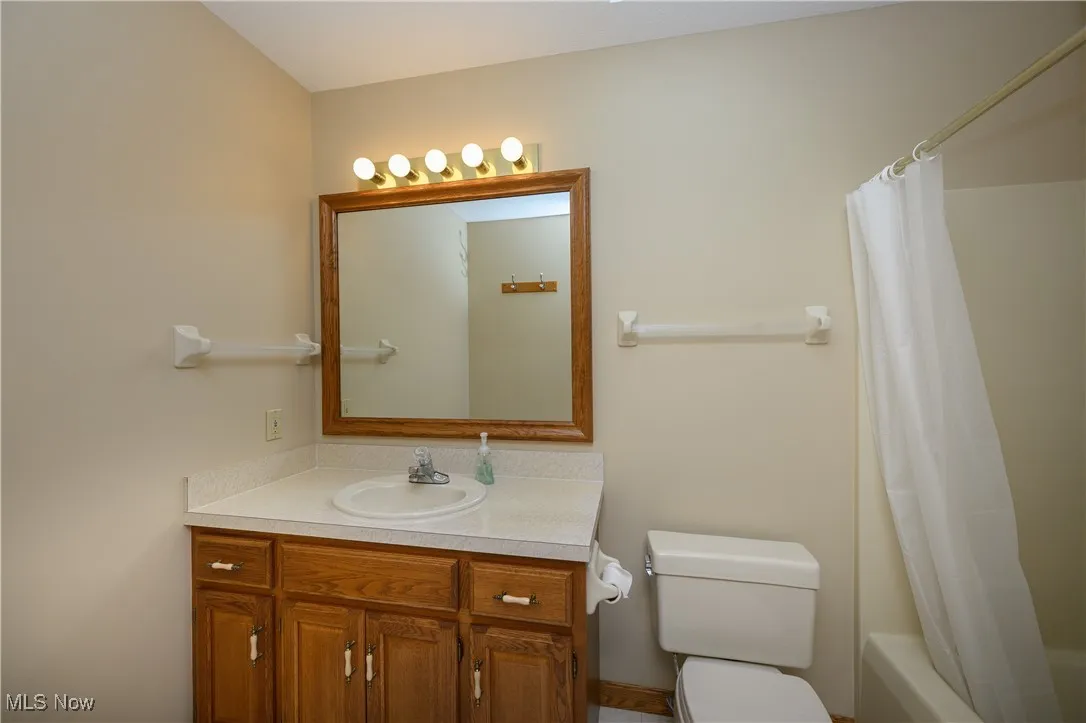 Bathroom featuring vanity and shower / bath combo