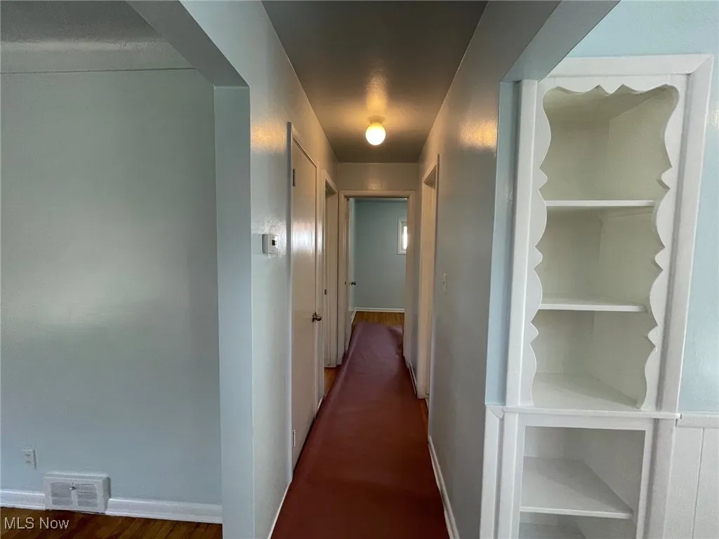 Hall from the living room to the bathroom and 2 bedrooms
