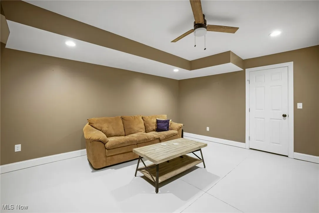 Living area with ceiling fan and recessed lighting