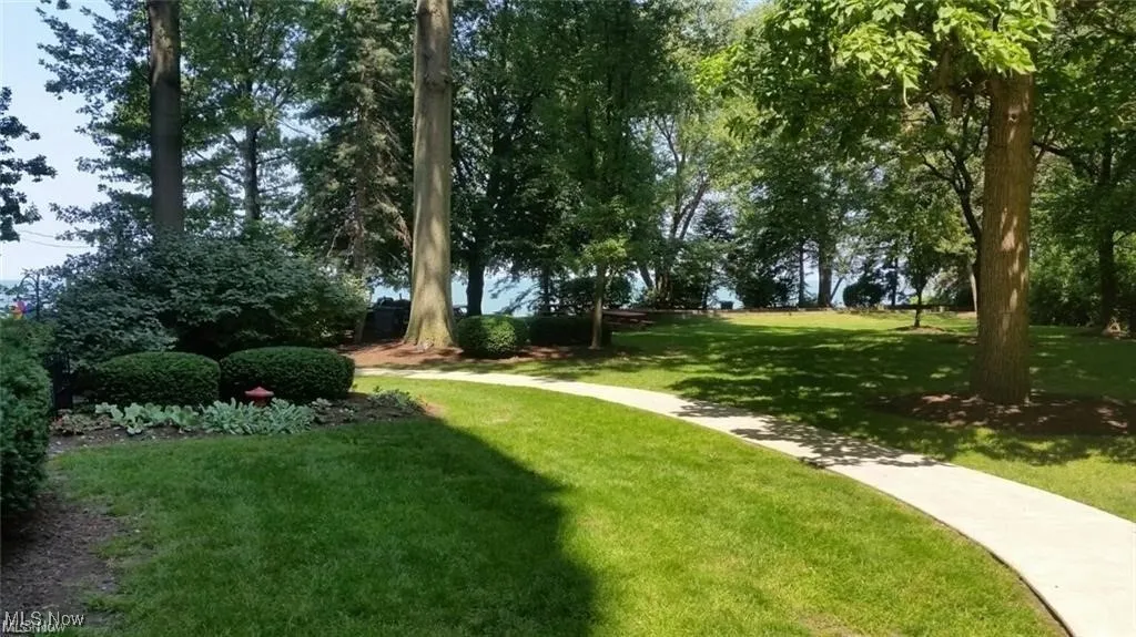 View of property's community featuring a lawn