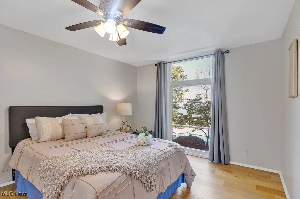 Bedroom featuring light wood-type flooring and ceiling fan