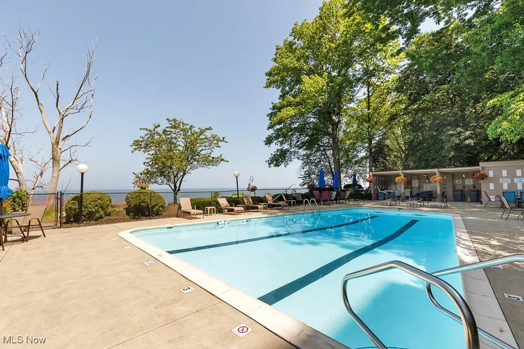 Community pool featuring a patio area