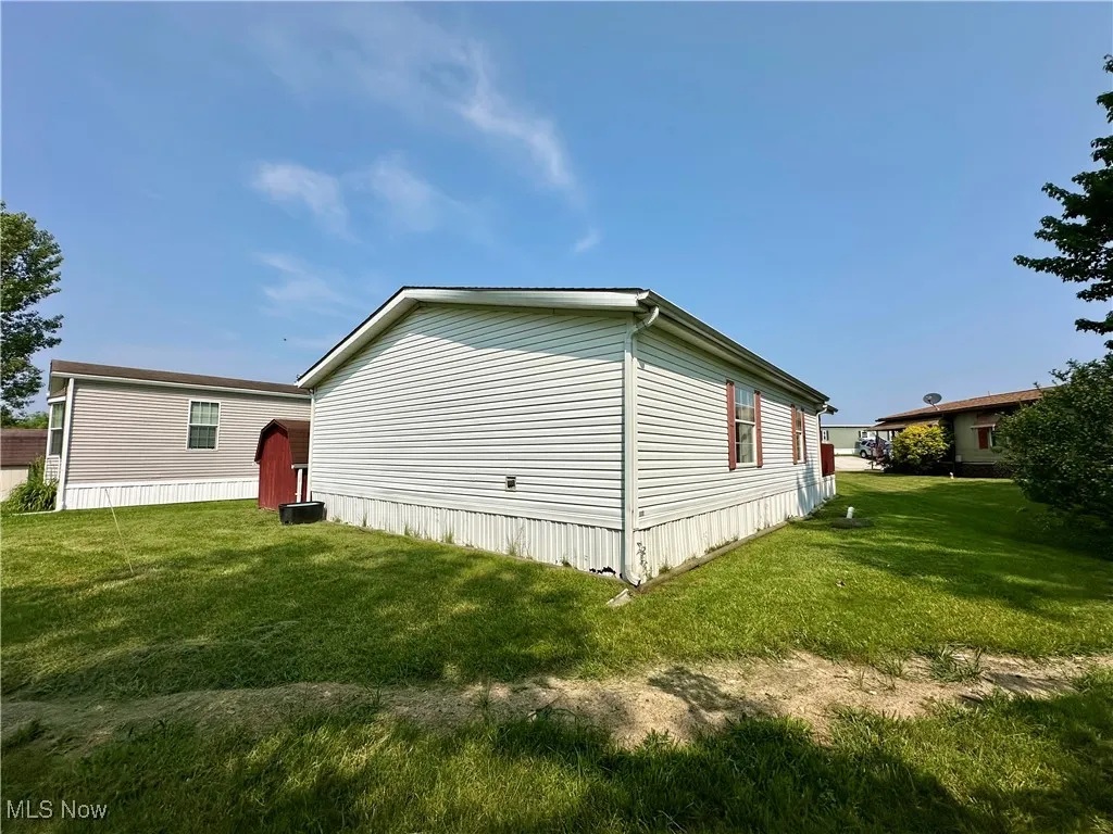 View of home's exterior with a lawn