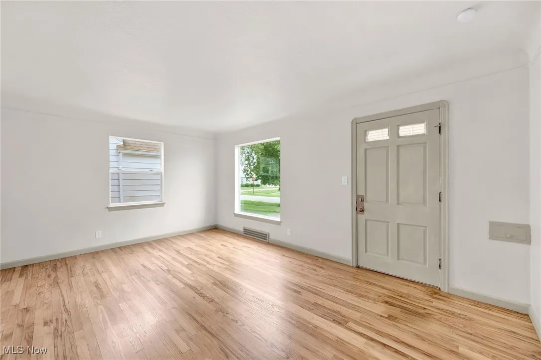 Foyer with light wood-style flooring