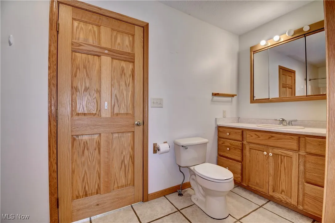 Bathroom with vanity and tile patterned flooring