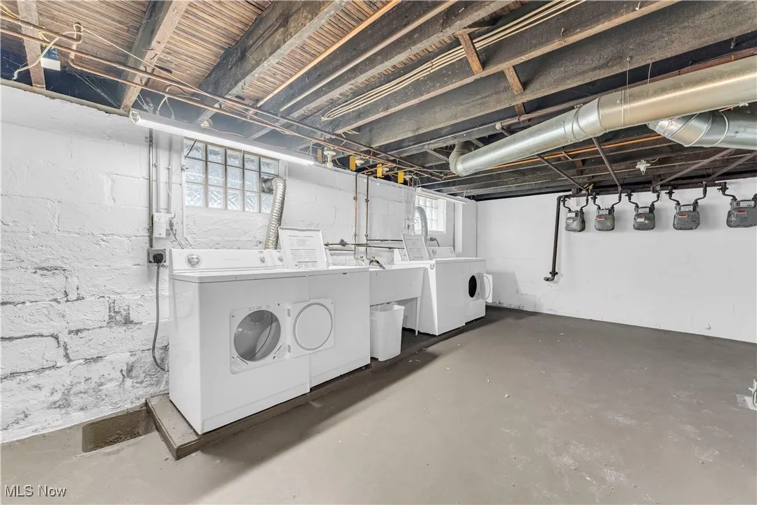 Below grade area with washing machine and dryer and gas meter