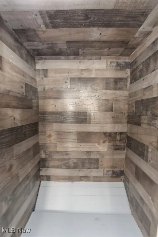 Bathroom with a sauna and wood walls