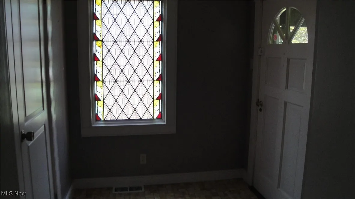 Foyer with baseboards