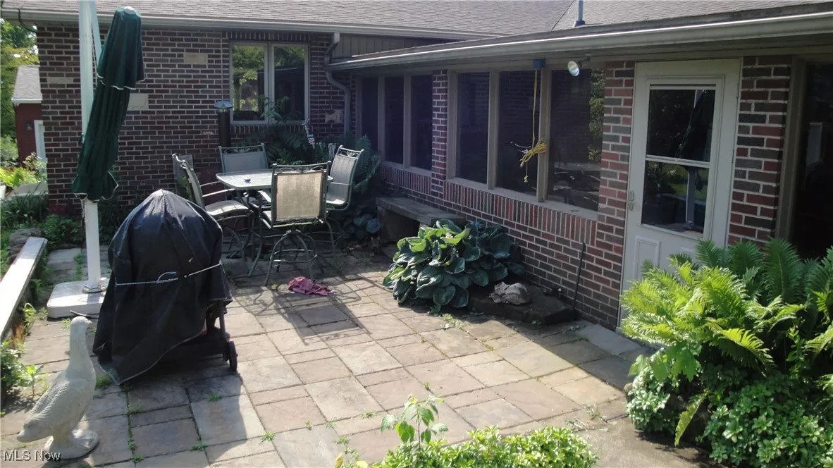 View of patio / terrace featuring area for grilling and outdoor dining space