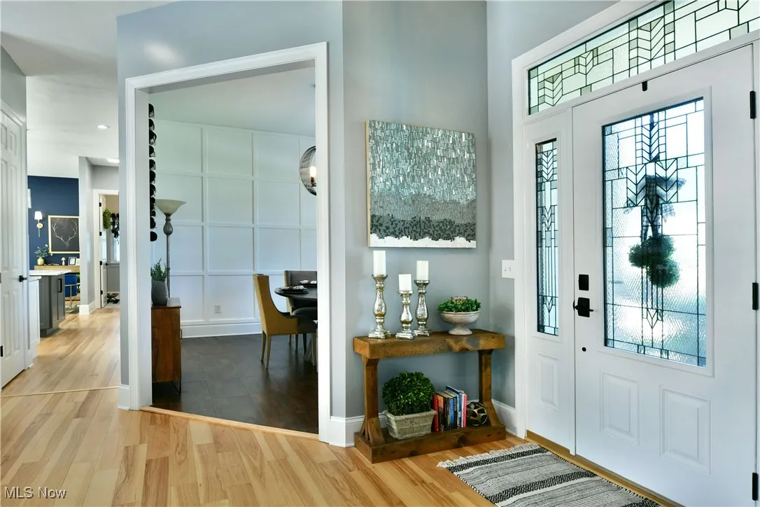 Foyer entrance featuring light wood-style flooring and recessed lighting