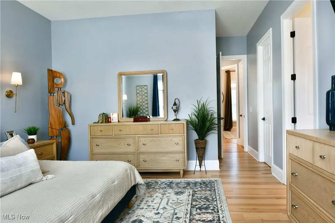 Bedroom featuring light wood finished floors and baseboards