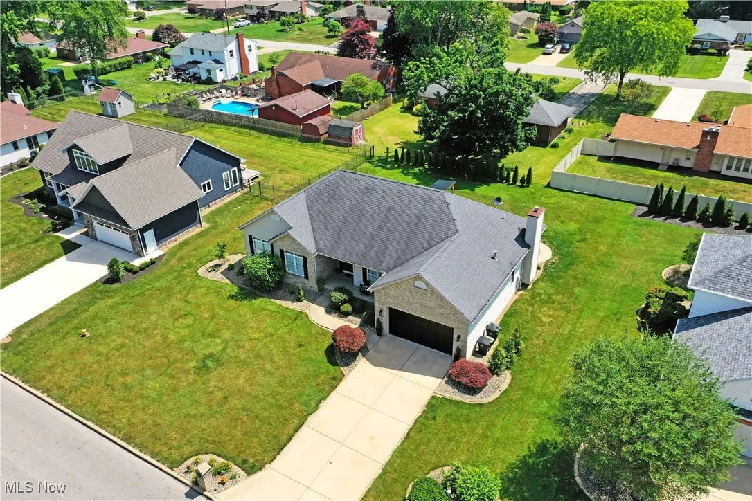 Aerial perspective of suburban area with a pool area