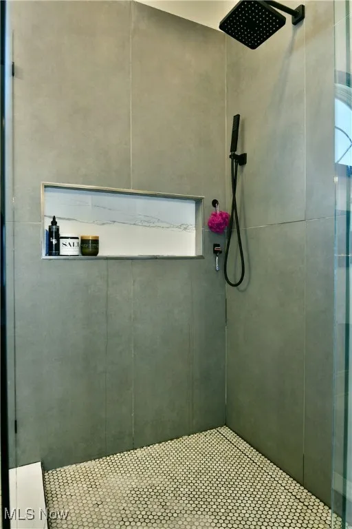 Bathroom with tiled shower