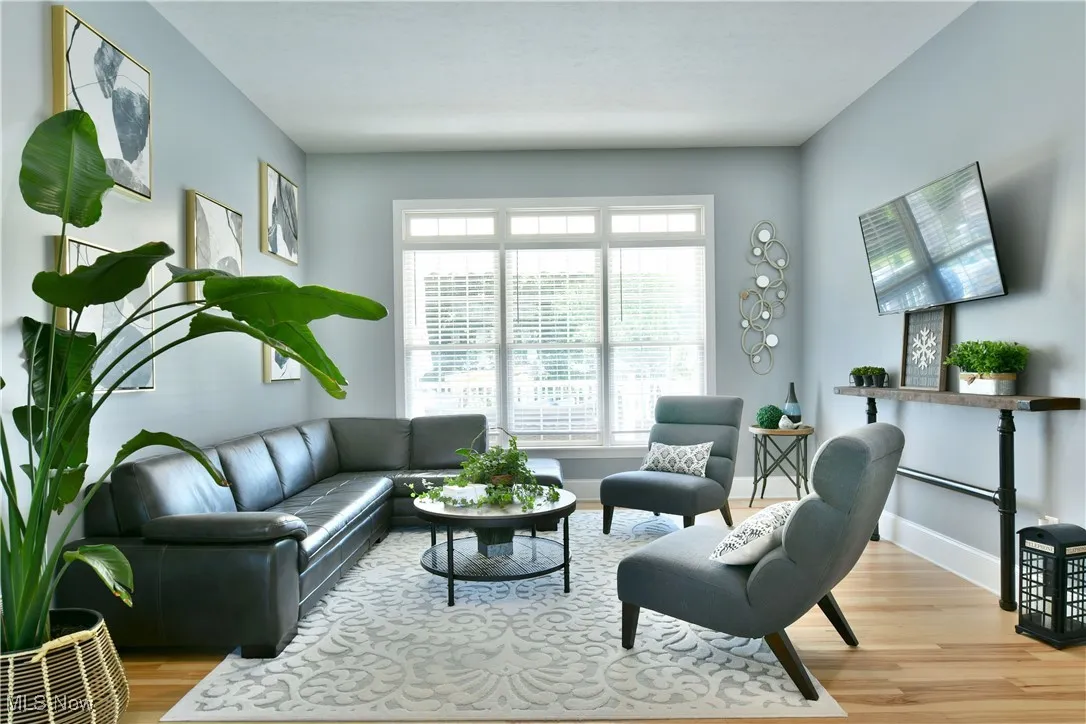 Living area featuring light wood finished floors and baseboards
