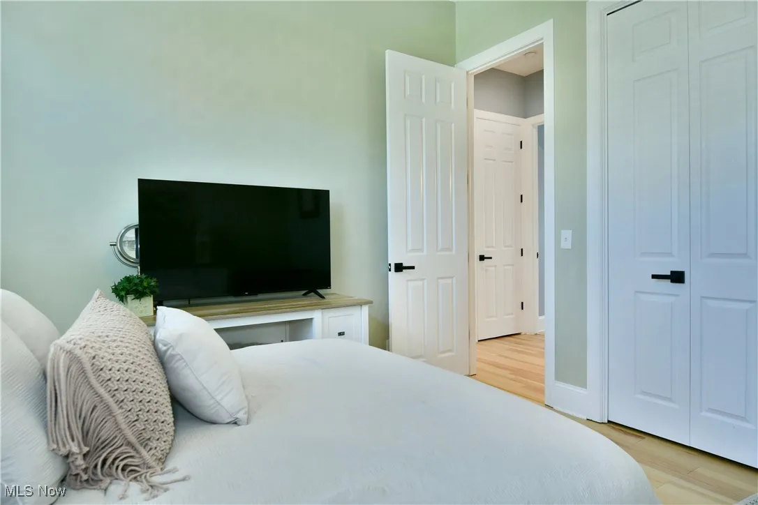 Bedroom with wood finished floors