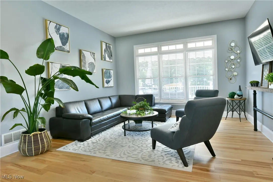 Living area featuring light wood finished floors and baseboards