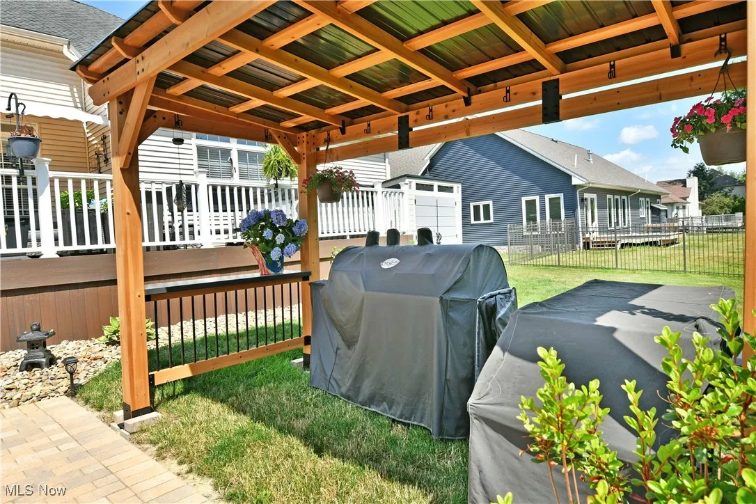 View of patio / terrace with area for grilling and a wooden deck