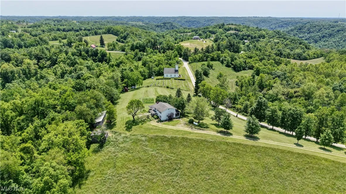 View of rural area featuring a heavily wooded area