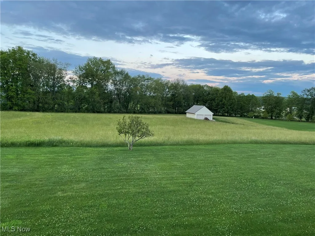 View from back upper deck showing spacious 23 x 43 out building with 24 x 32 loft