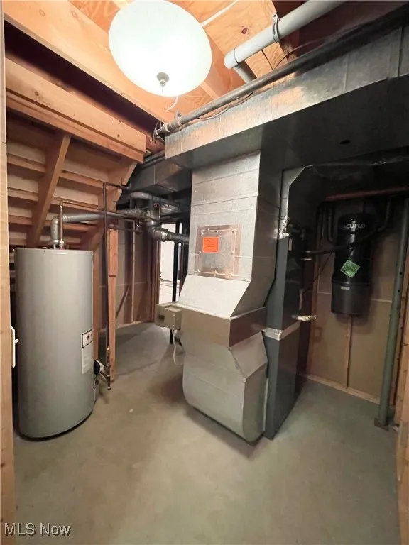 Utility room in basement with central vac and electronic air cleaner on furnace