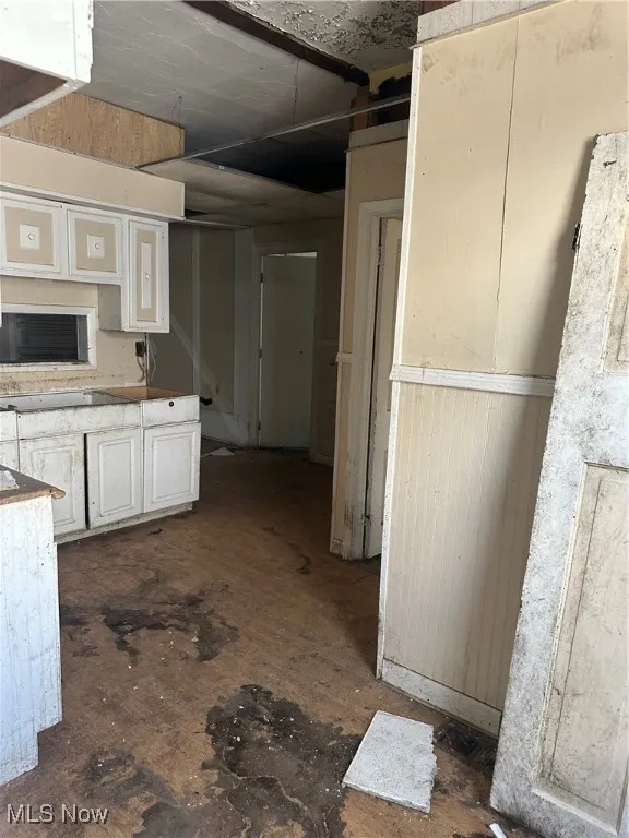 Kitchen featuring white cabinetry