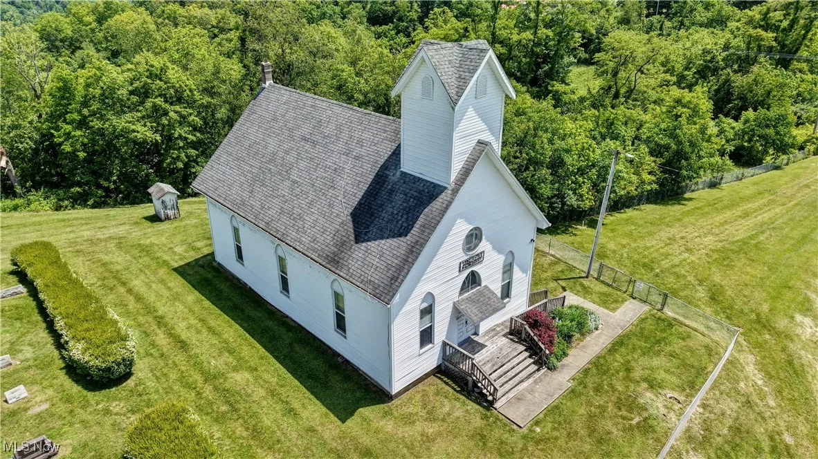 View from above of property with a forest