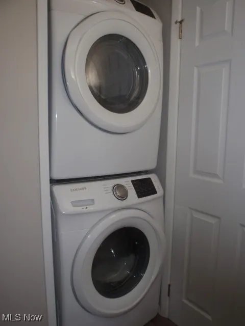 Laundry area with stacked washing machine and dryer