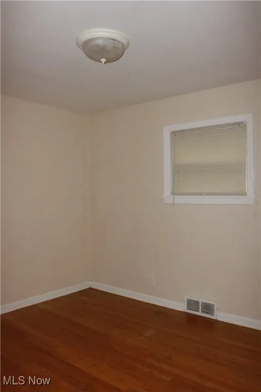 Empty room with wood finished floors