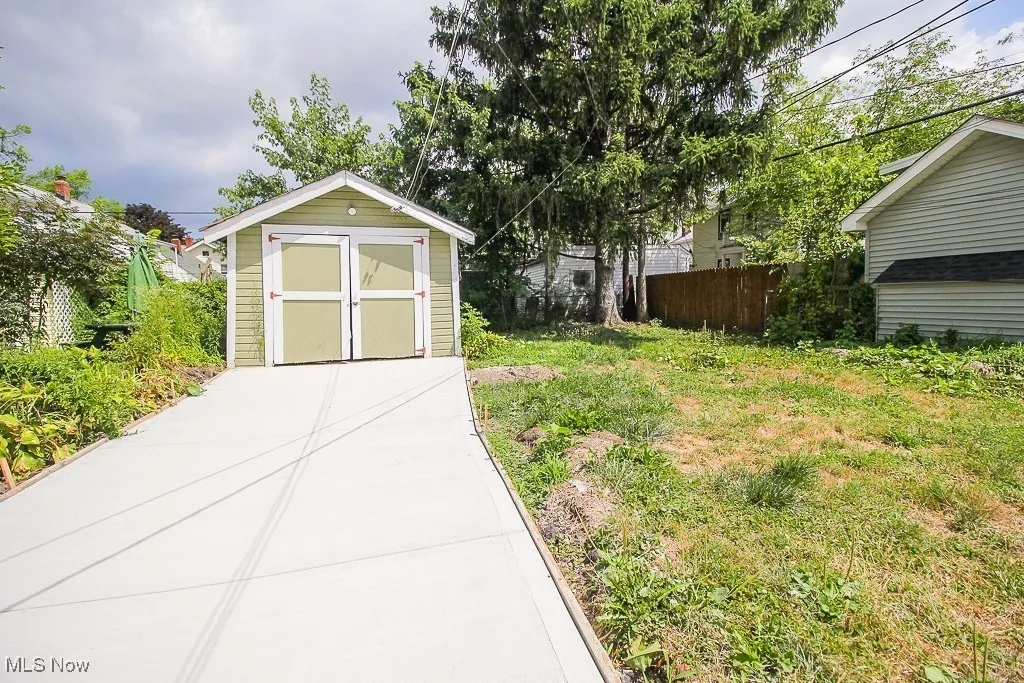 View of yard with a storage unit