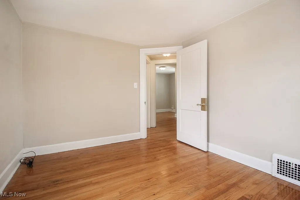 Empty room featuring light wood finished floors