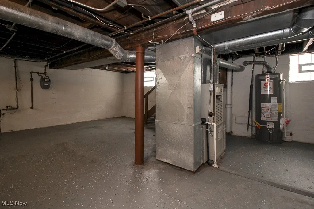 Below grade area with water heater and heating unit