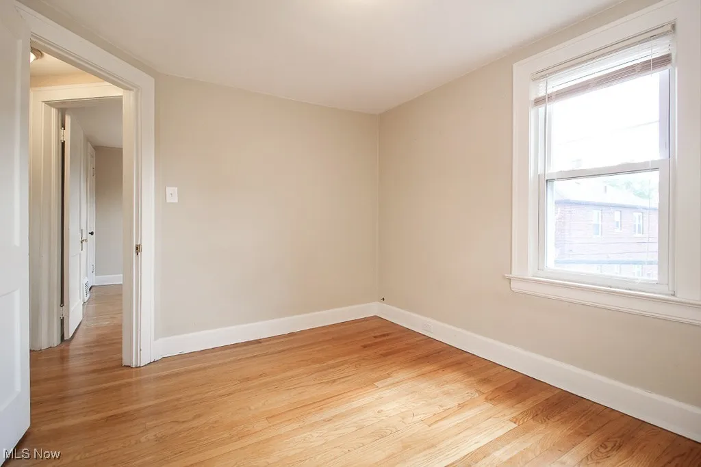Empty room with light wood-type flooring