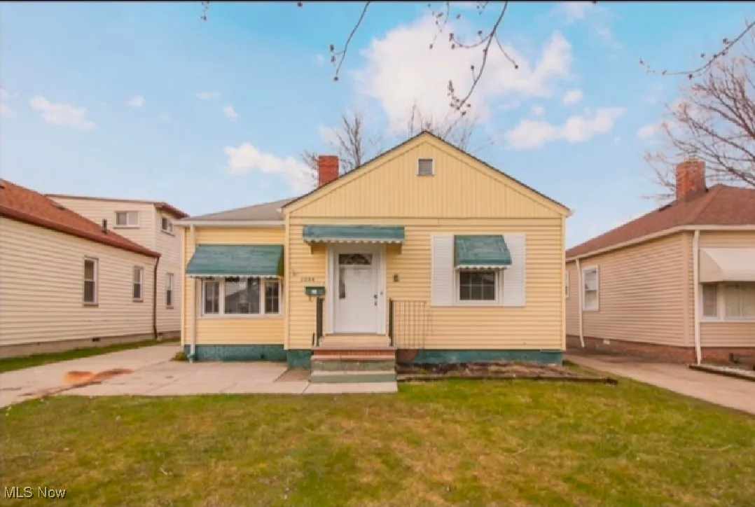 View of front of property with a front lawn and a chimney