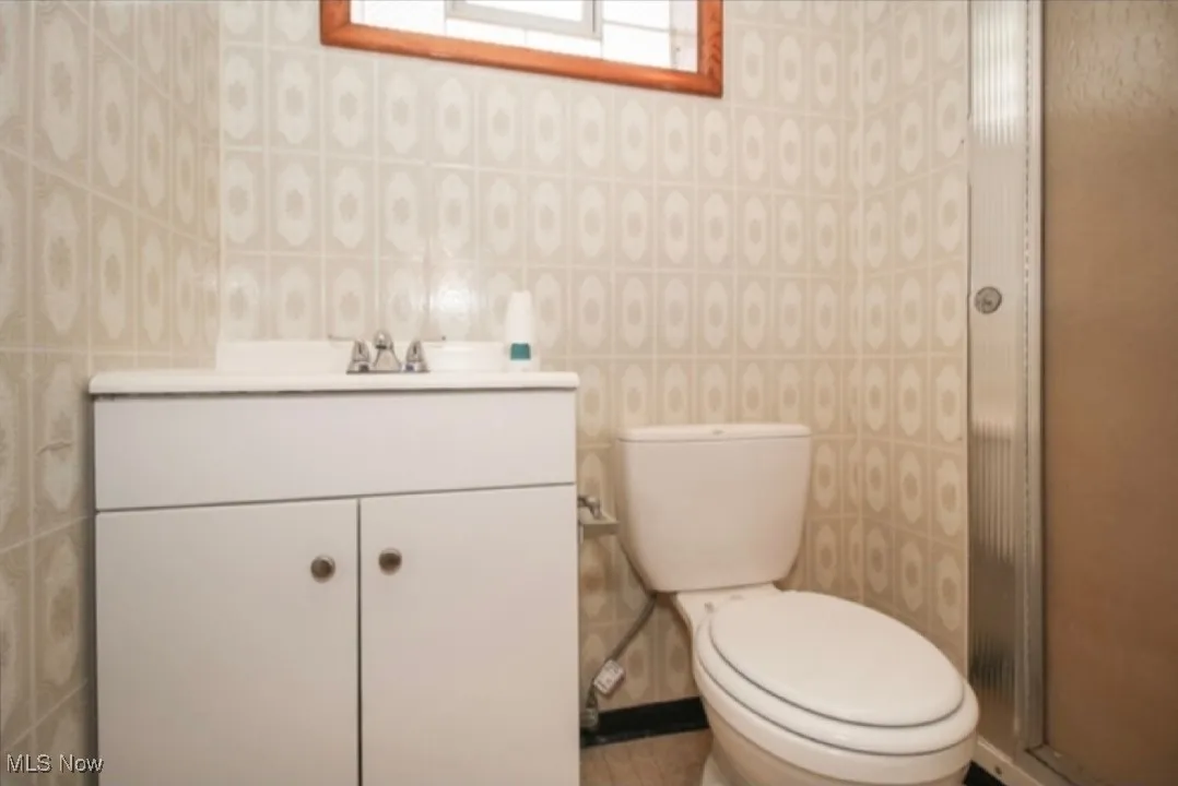 Bathroom with vanity and a shower stall