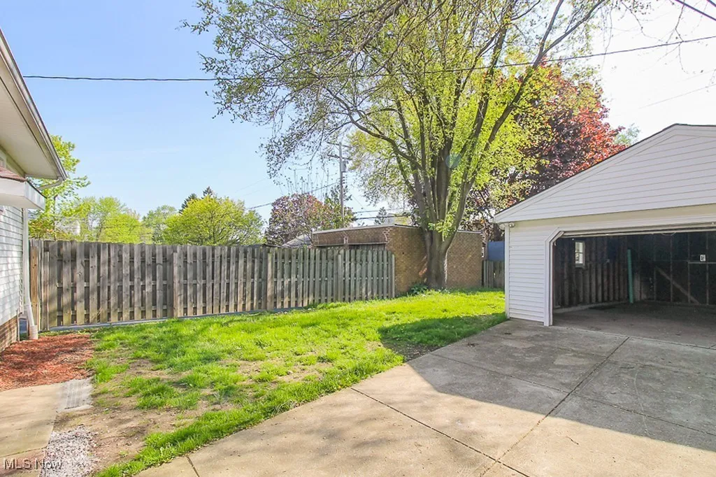 View of yard with a garage