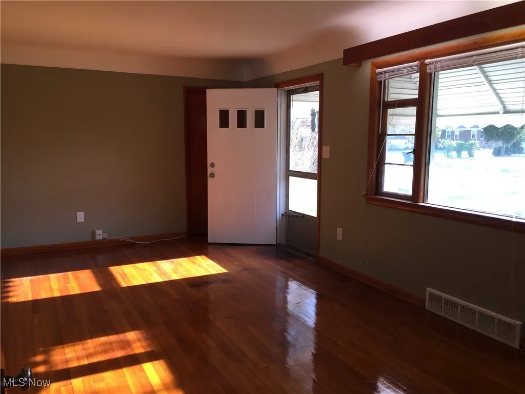 Foyer entrance featuring wood finished floors