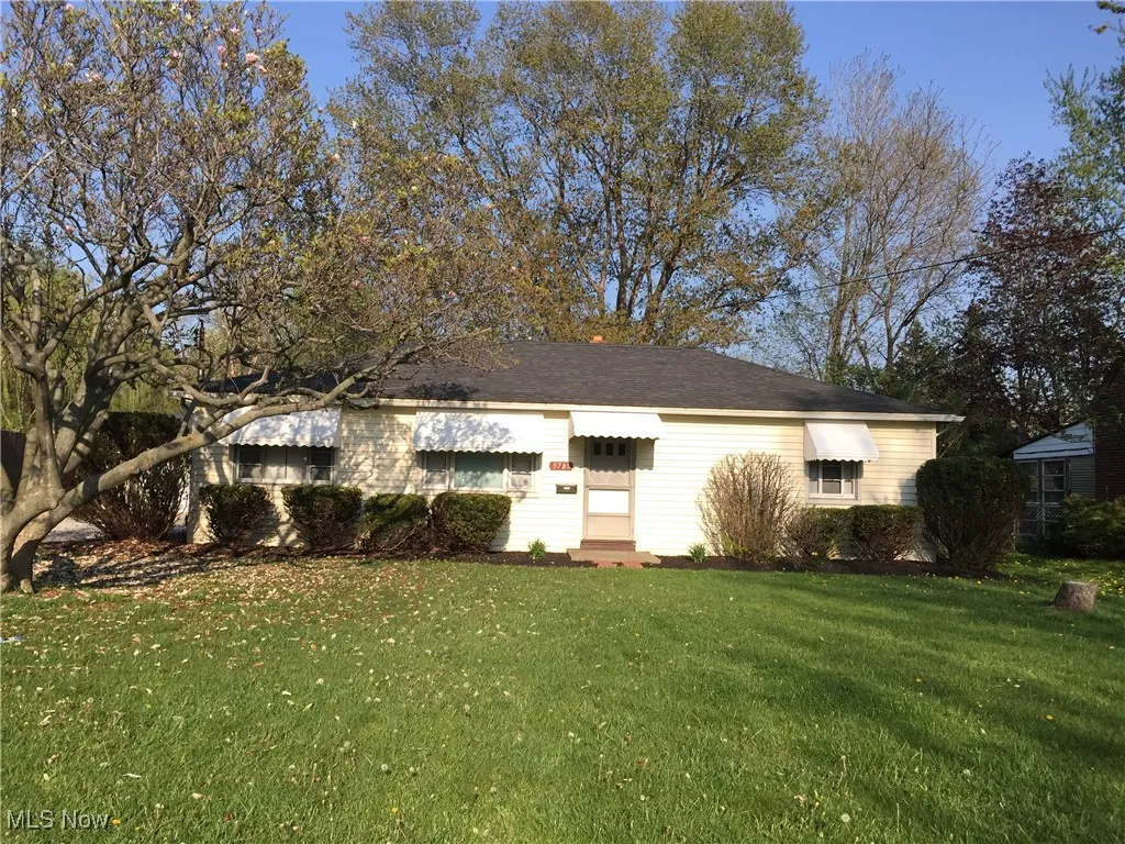 View of front of property with a front yard