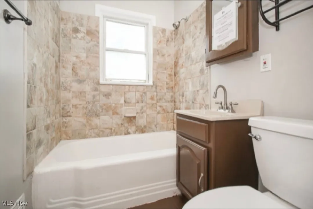 Full bathroom featuring vanity and bathtub / shower combination