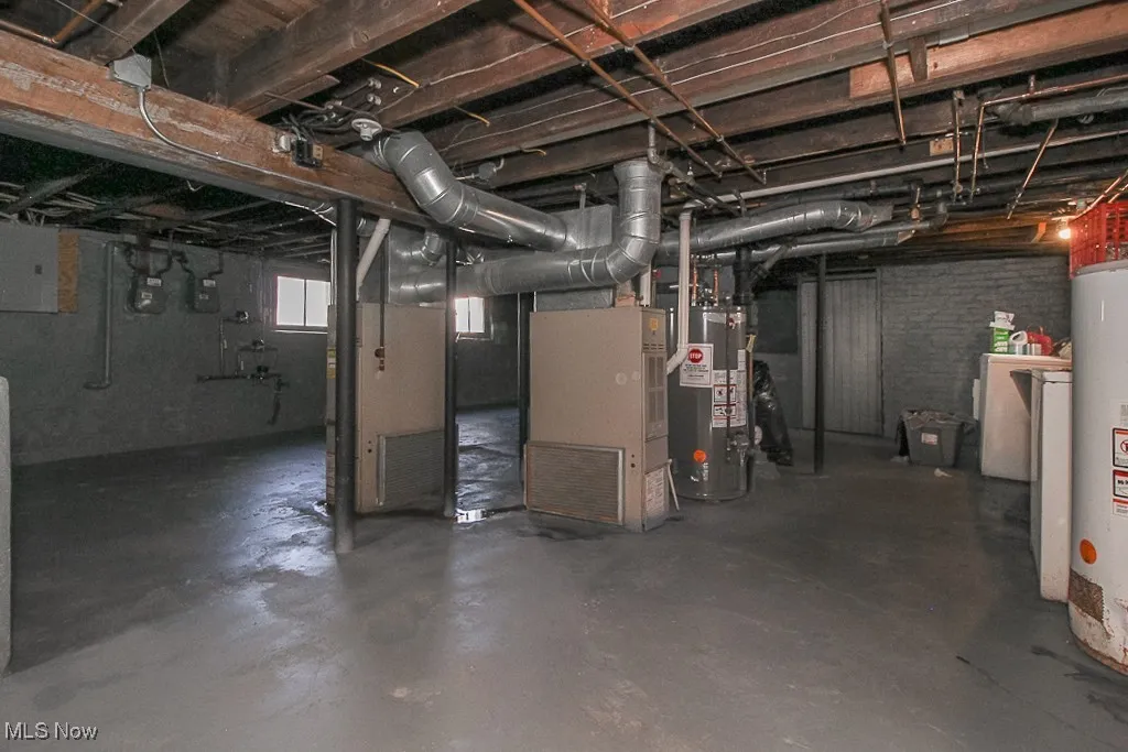 Below grade area with water heater and heating unit