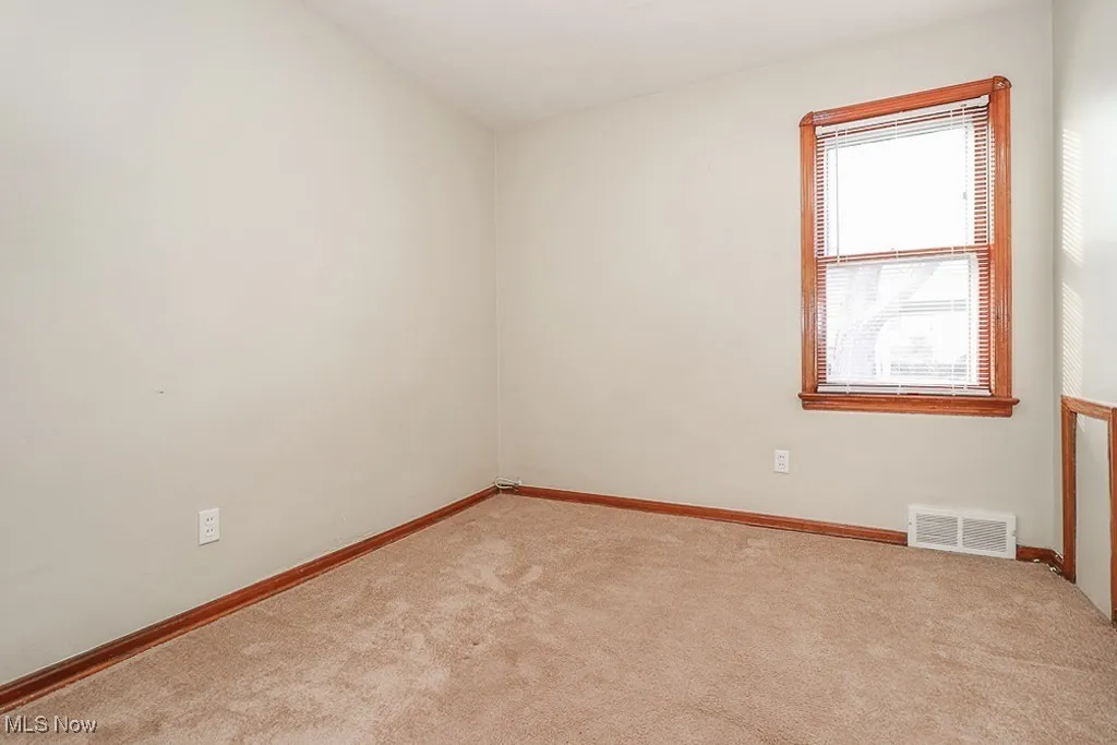Spare room with carpet flooring and baseboards