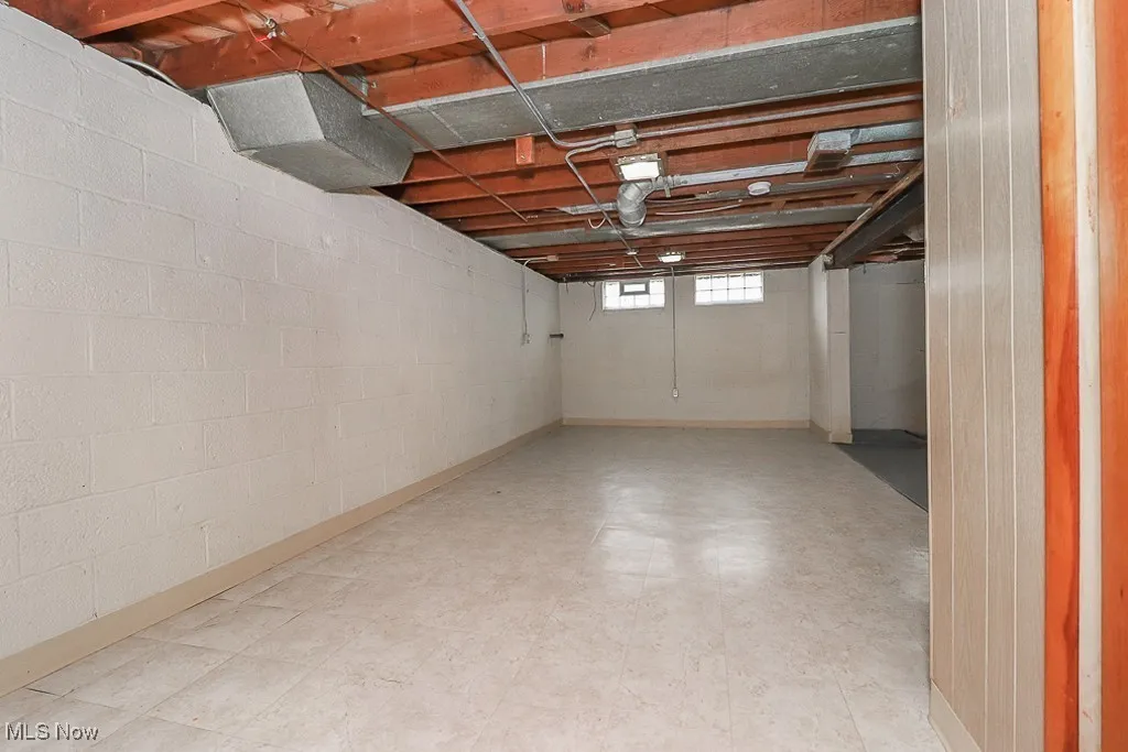 Below grade area featuring tile patterned floors