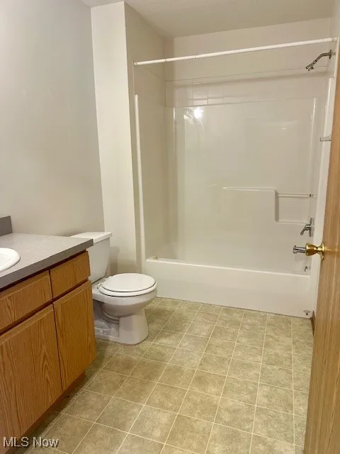 Bathroom with vanity and shower / bath combination