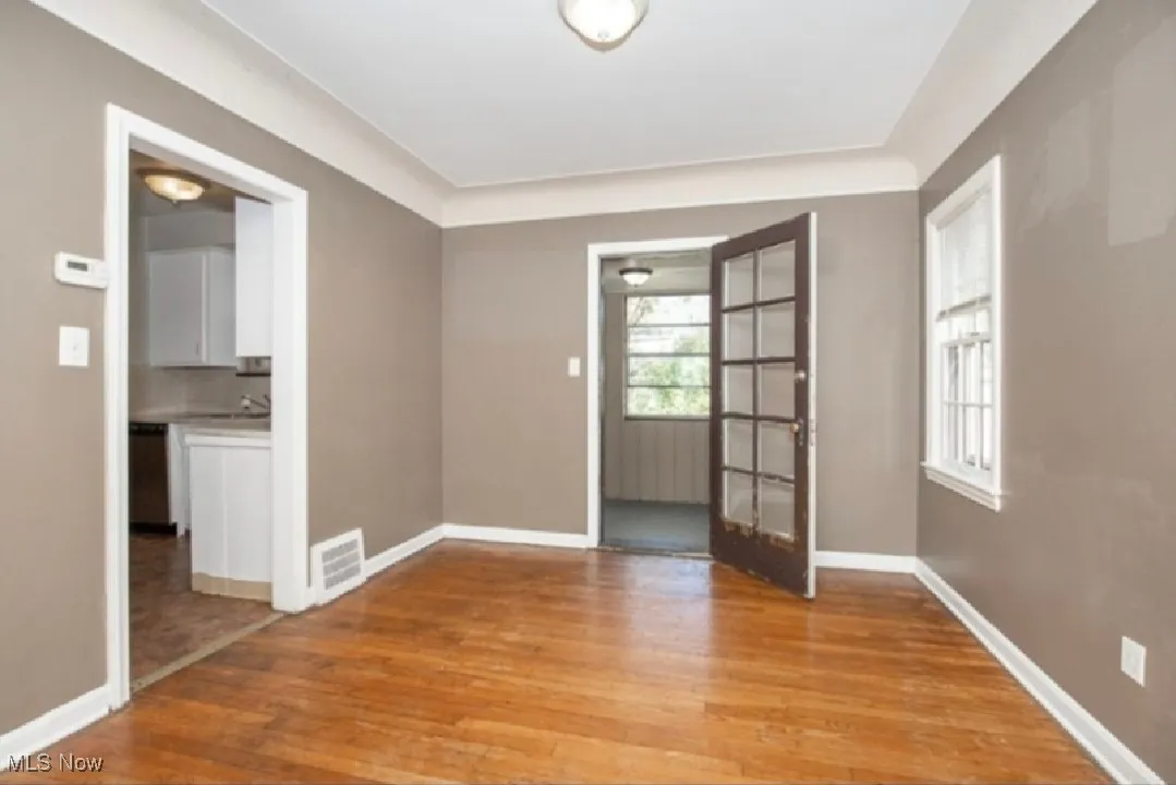 Empty room featuring light wood-style flooring and baseboards
